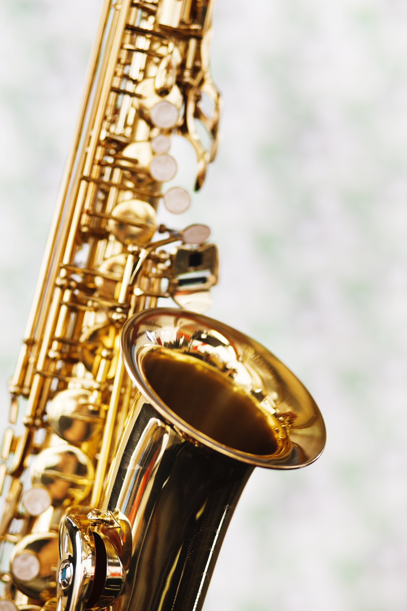Close up on bell of shiny golden saxophone